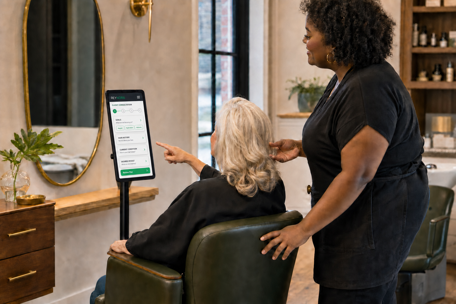 Stylist and client using Reynora during a chairside consultation